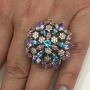 Женское кольцо с разноцветными драгоценными камнями
