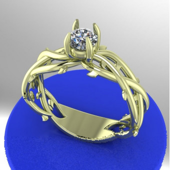 Кольцо в виде переплетенных ветвей с голубым сапфиром